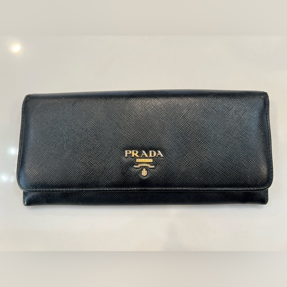 Prada Handbags - Prada Black Saffiano Wallet with Gold Emblem